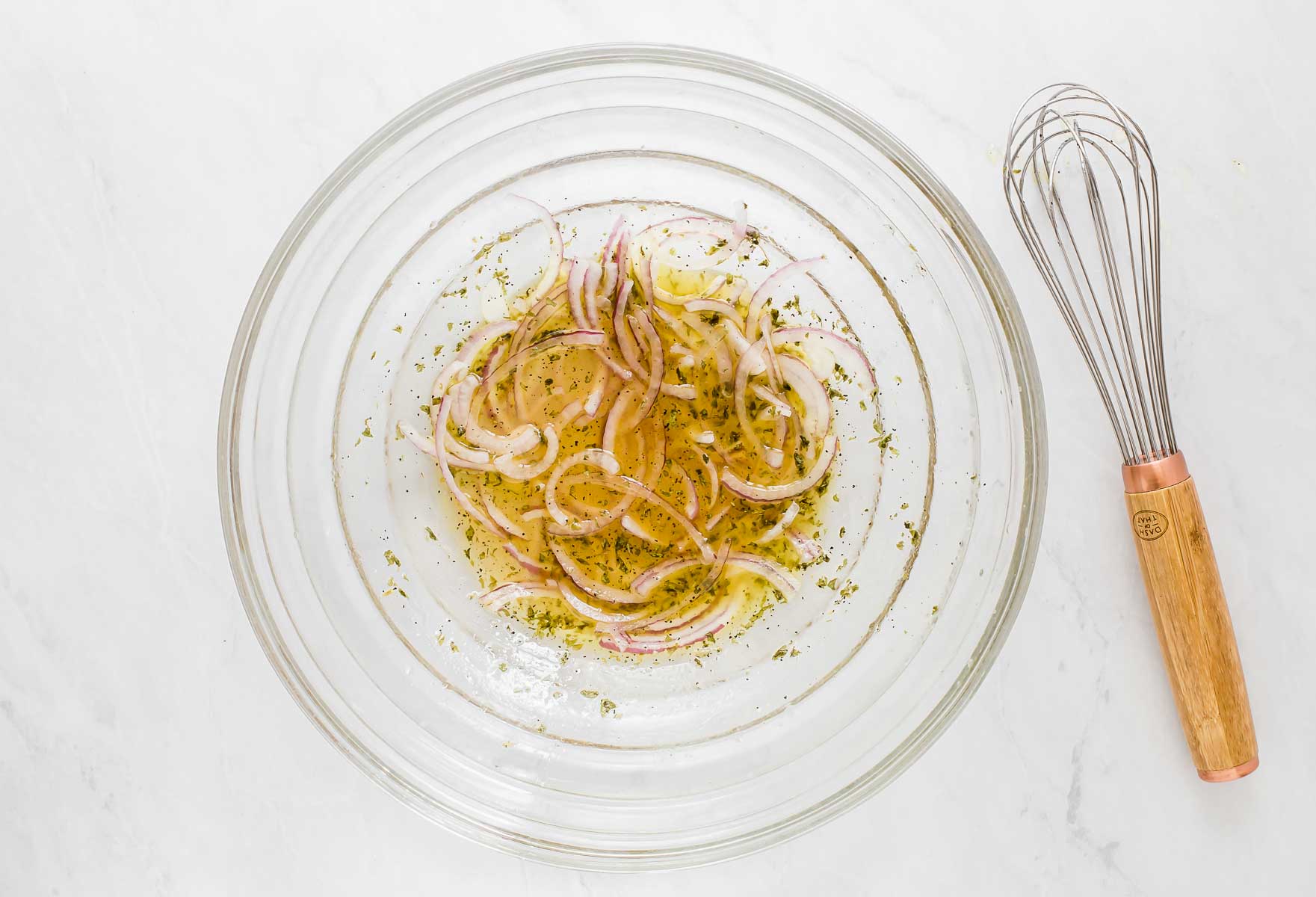 Thinly sliced onions in vinaigrette.