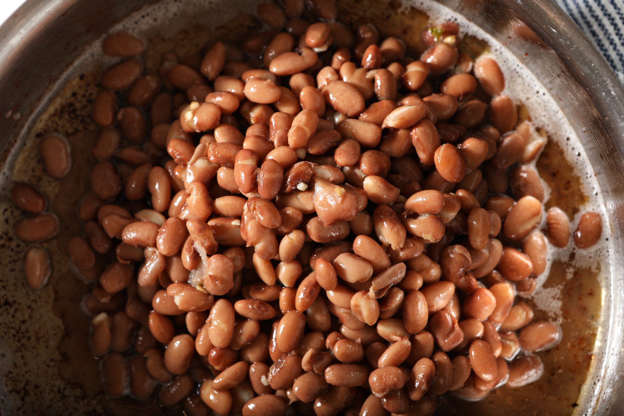 Pinto beans in skillet with bacon grease.