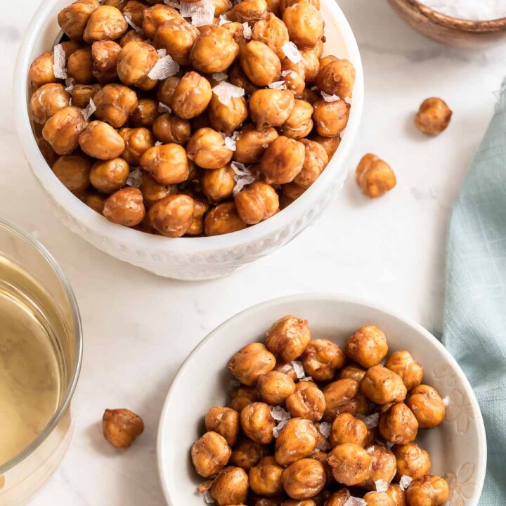 Two white bowls of crispy chickpeas.