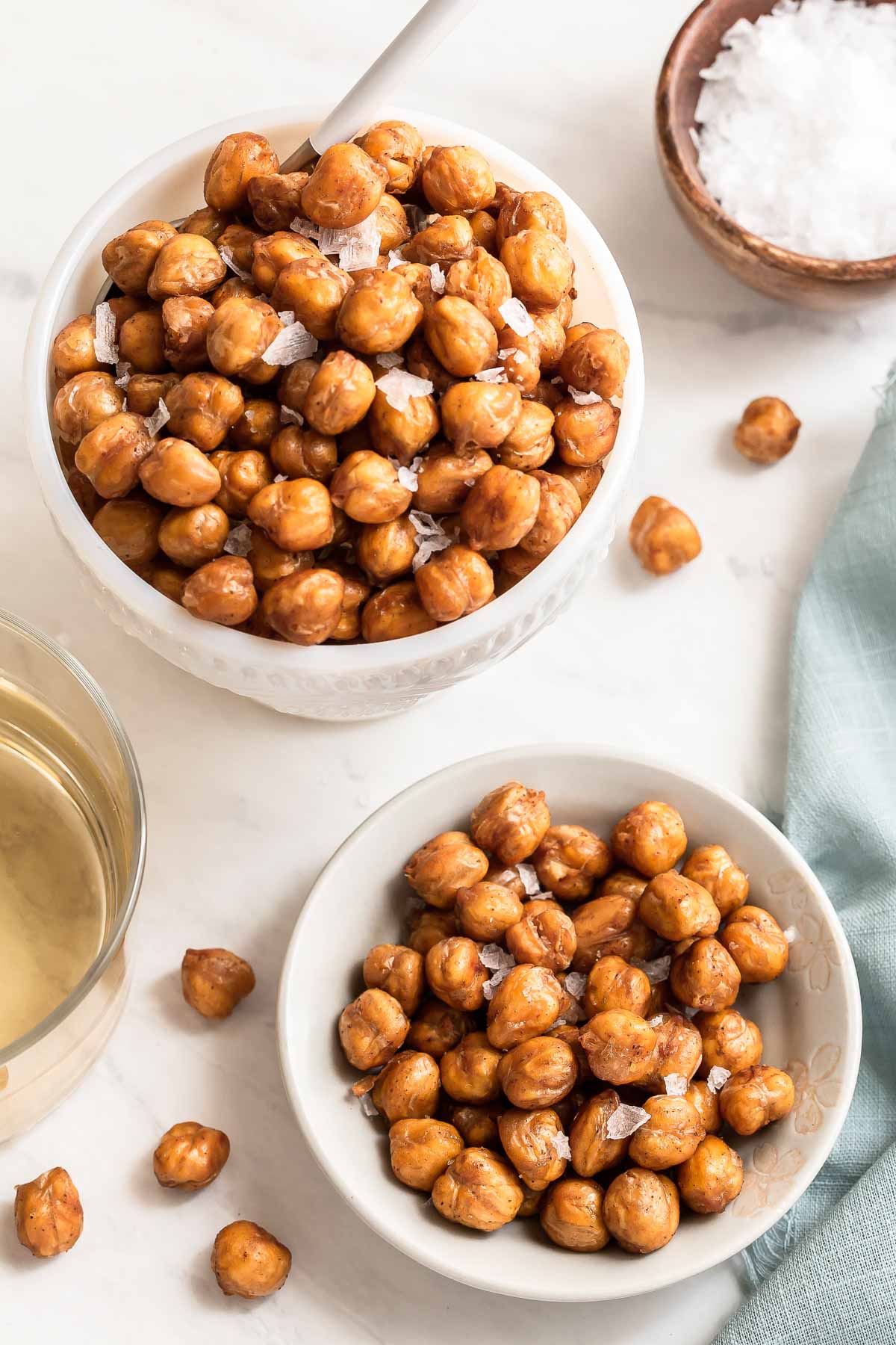 Two white bowls of crispy chickpeas.