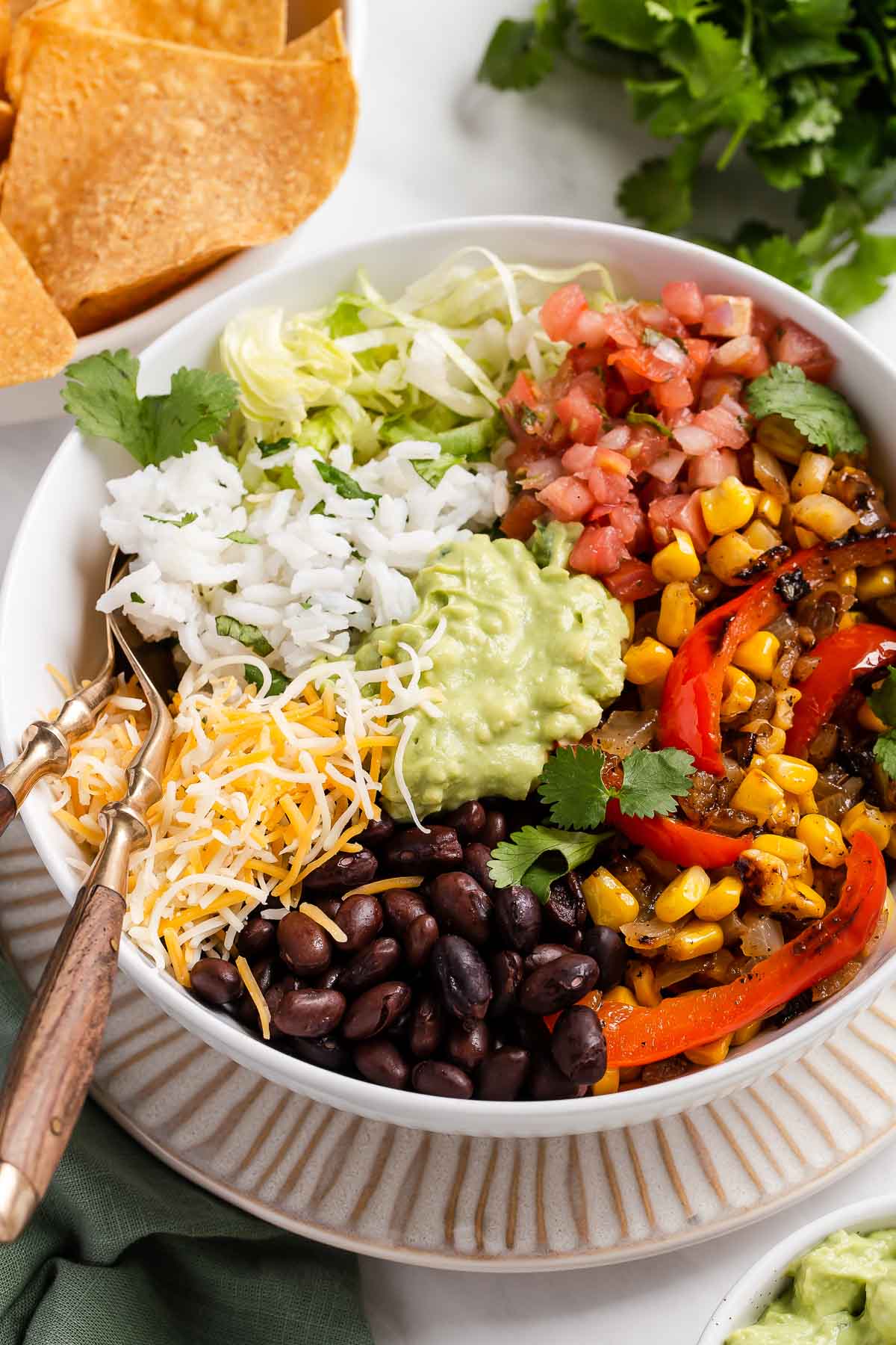 Colorful vegan burrito bowl made with black beans and bell peppers.