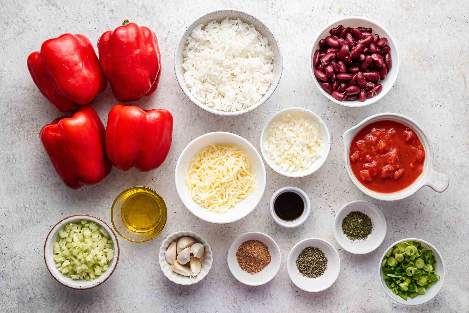 Ingredients to make rice and bean stuffed peppers.